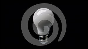 A white light bulb against a black background.