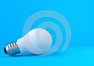 White light bulb on bright blue background in pastel colors