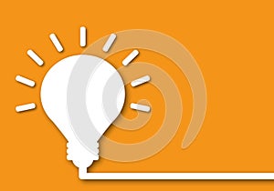 White light bulb on orange background. Ideas inspiration concepts of business finance.
