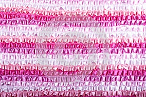 White, light pink, pink, dark pink, light purple and purple ribbon gathered