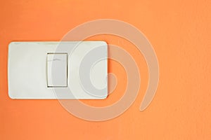 White light switch, turn on or turn off the lights on the orange wall