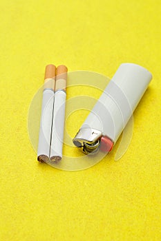 A white lighter with two cigarettes