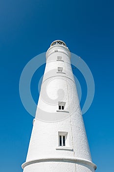 White lighthouse and associated buildings. Nash Point, Vale of Glamorgan, Wales..