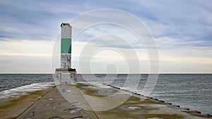 White lighthouse and breakwater