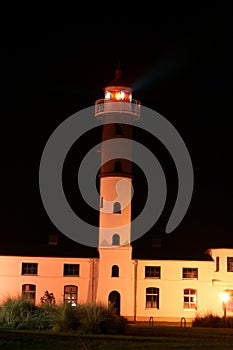 White Lighthouse Building at Night.