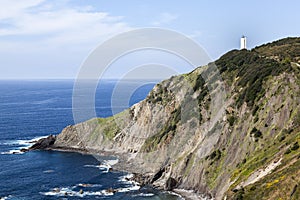 White lighthouse on the cliff