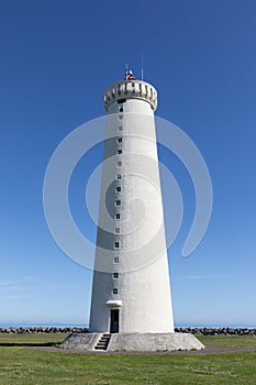 White lighthouse on the coast of Iceland.