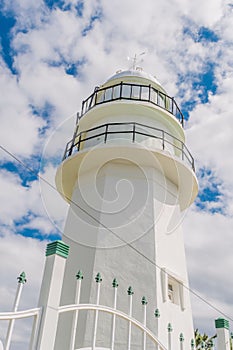 White lighthouse on the east coast of South Korea photo