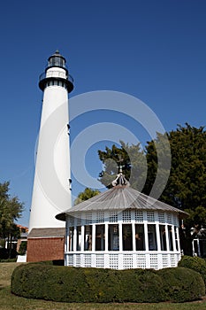 White Lighthouse and Gazebo Under Blue Skies