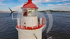 White lighthouse with red roof on Tokarev cat