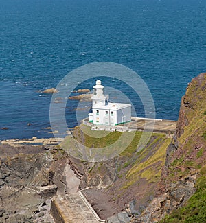 White Lighthouse on rocks