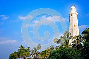 White lighthouse on the shores of the ocean