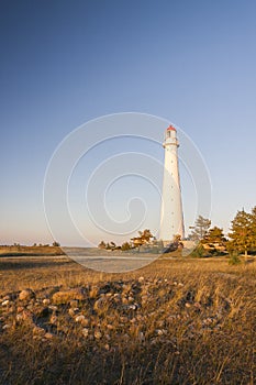 White lighthouse and stone labyrinth