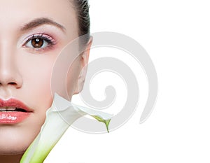White lily flowers and young woman face closeup isolated on white background
