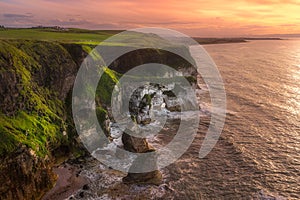 White, limestone cliffs seen from Magheracross viewpoint at dramatic sunset