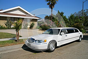 White limousine at driveway