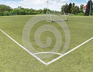 White line corner of the soccer field, pattern of green grass for football sport,