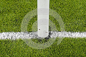 The white Line marking on the artificial green grass soccer field