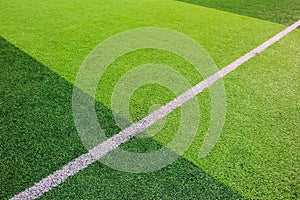 The white Line marking on the artificial green grass soccer field