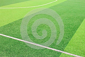 The white Line marking on the artificial green grass soccer field