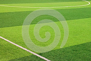 The white Line marking on the artificial green grass soccer field