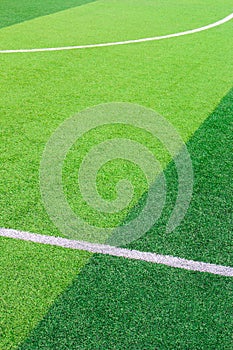 The white Line marking on the artificial green grass soccer field