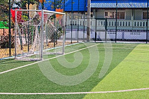 The white Line marking on the artificial green grass soccer field