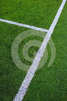 The white Line marking on the artificial green grass soccer field