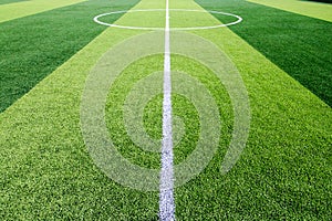 The white Line marking on the artificial green grass soccer field