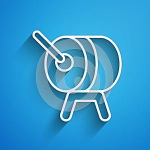 White line Ramadan drum icon isolated on blue background. Long shadow. Vector
