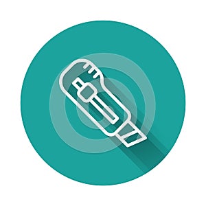 White line Stationery knife icon isolated with long shadow. Office paper cutter. Green circle button. Vector