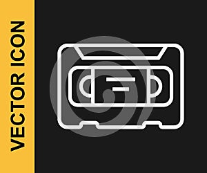 White line VHS video cassette tape icon isolated on black background. Vector