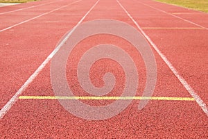 White lines and texture of running racetrack, red rubber racetracks in small stadium