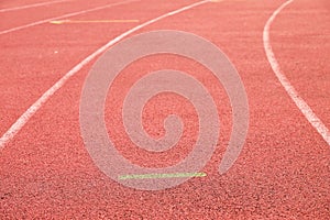 White lines and texture of running racetrack, red rubber racetracks in small stadium