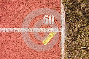 White lines and texture of running racetrack, red rubber racetracks in small stadium