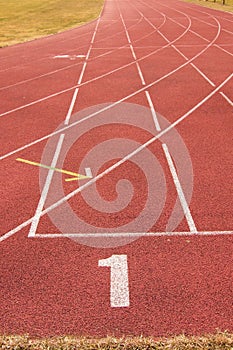 White lines and texture of running racetrack, red rubber racetracks in small stadium