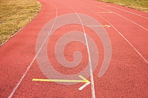 White lines and texture of running racetrack, red rubber racetracks in small stadium