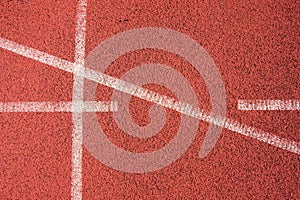 White lines and texture of running racetrack, red rubber racetracks in small stadium