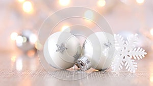 White little Christmas ornaments with snowflake and blinking lights behind
