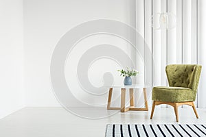 White living room with armchair