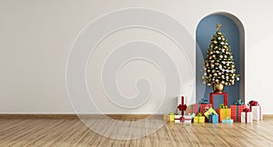 White living room with Christmas tree and gift in a niche