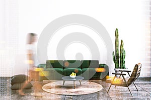 White living room, green sofa, woman