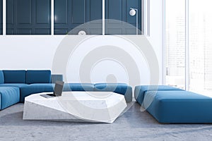 White living room interior, blue sofa