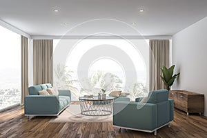 White living room interior, blue sofa