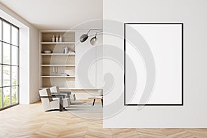White living room interior with bookcase and poster