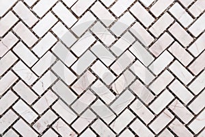 White or llight grey color marble stone wall texture or abstract background. Herringbone pattern photo