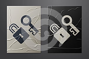 White Lock with key icon isolated on crumpled paper background. Love symbol and keyhole sign. Paper art style. Vector