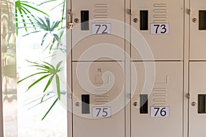 White lockers for safe storage There are numbers attached for memorization photo