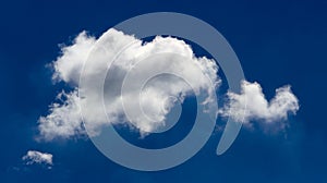 White lonely cloud in the background of the blue sky