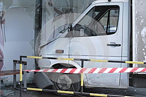 White lorry collided with a glass wall of shopping mall